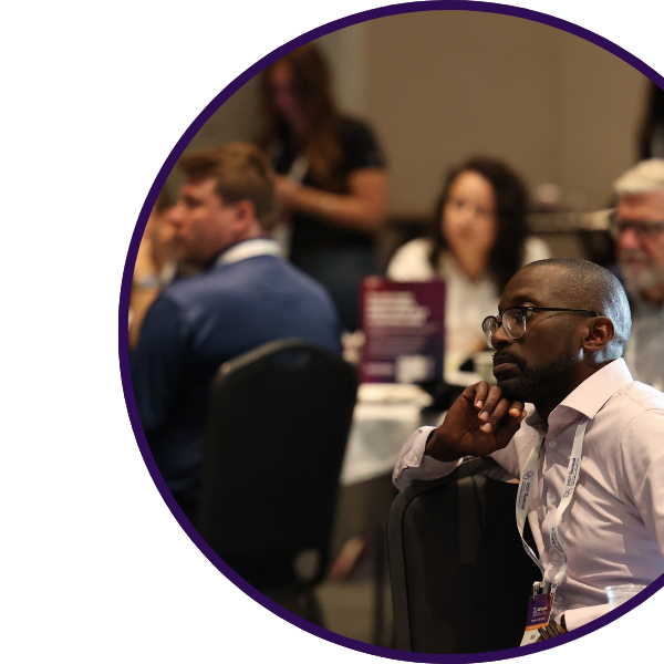 Session attendees looking thoughtfully at presenter