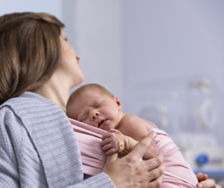 mother holding baby