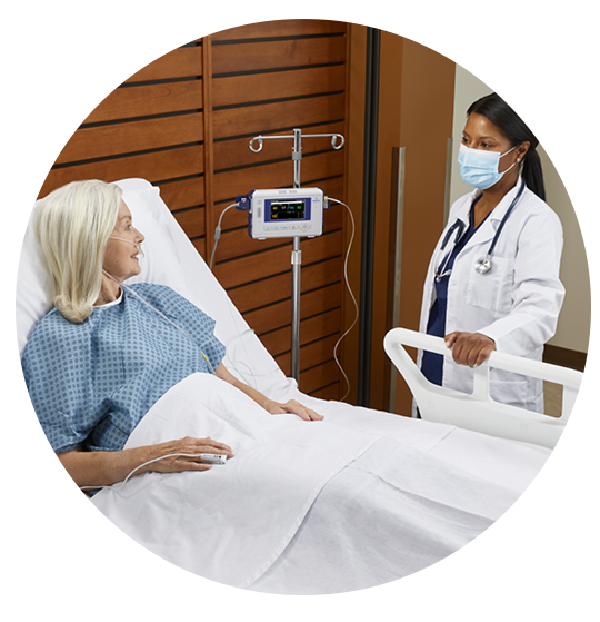 doctor talking to patient in bed