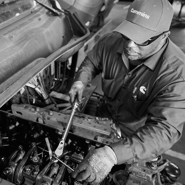 Employee working on an engine