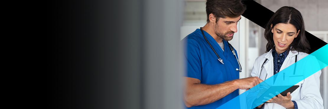 Doctor and nurse reviewing information on a Zebra tablet